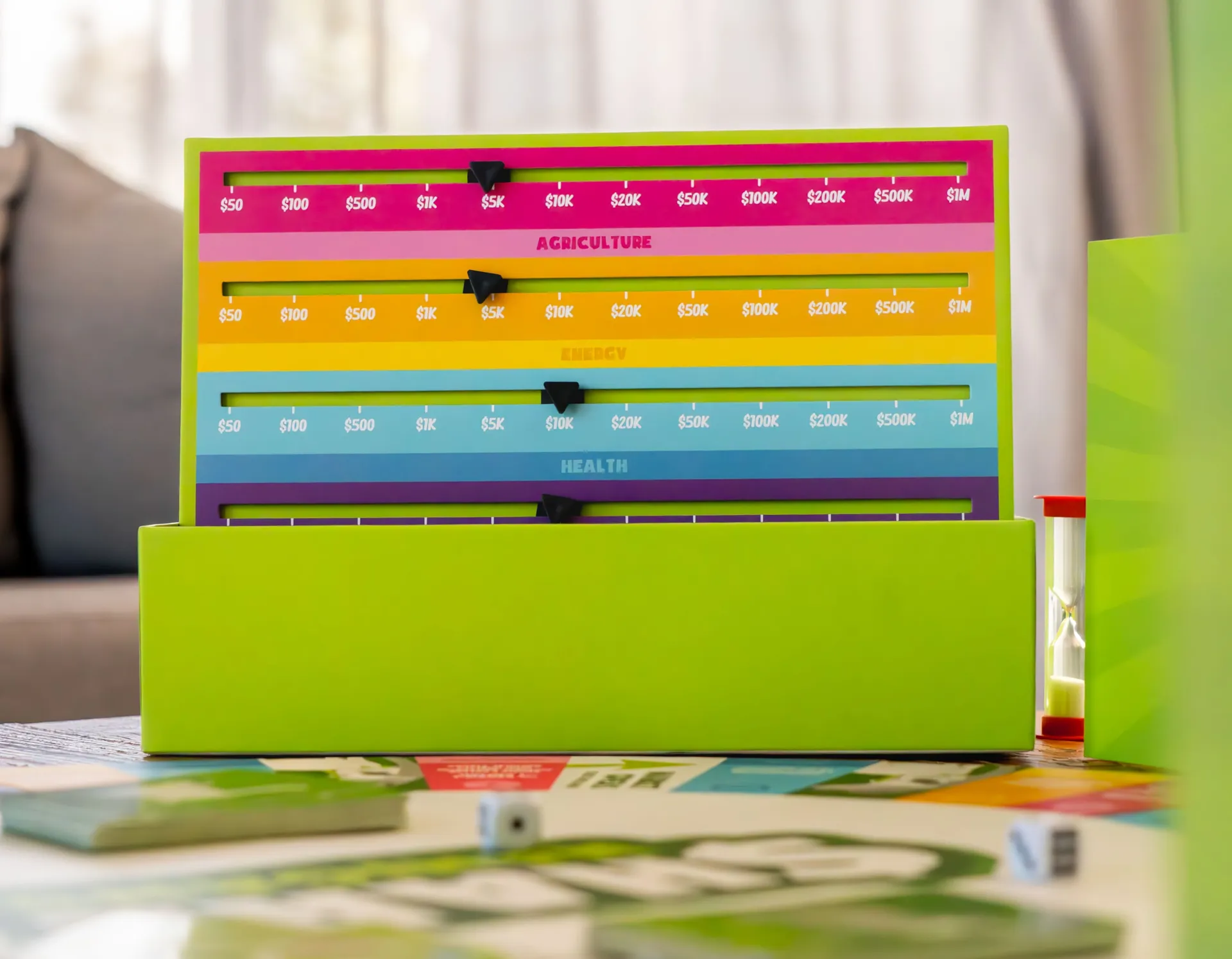 The Sharenanigans market price slider standing on a table beside the game board
